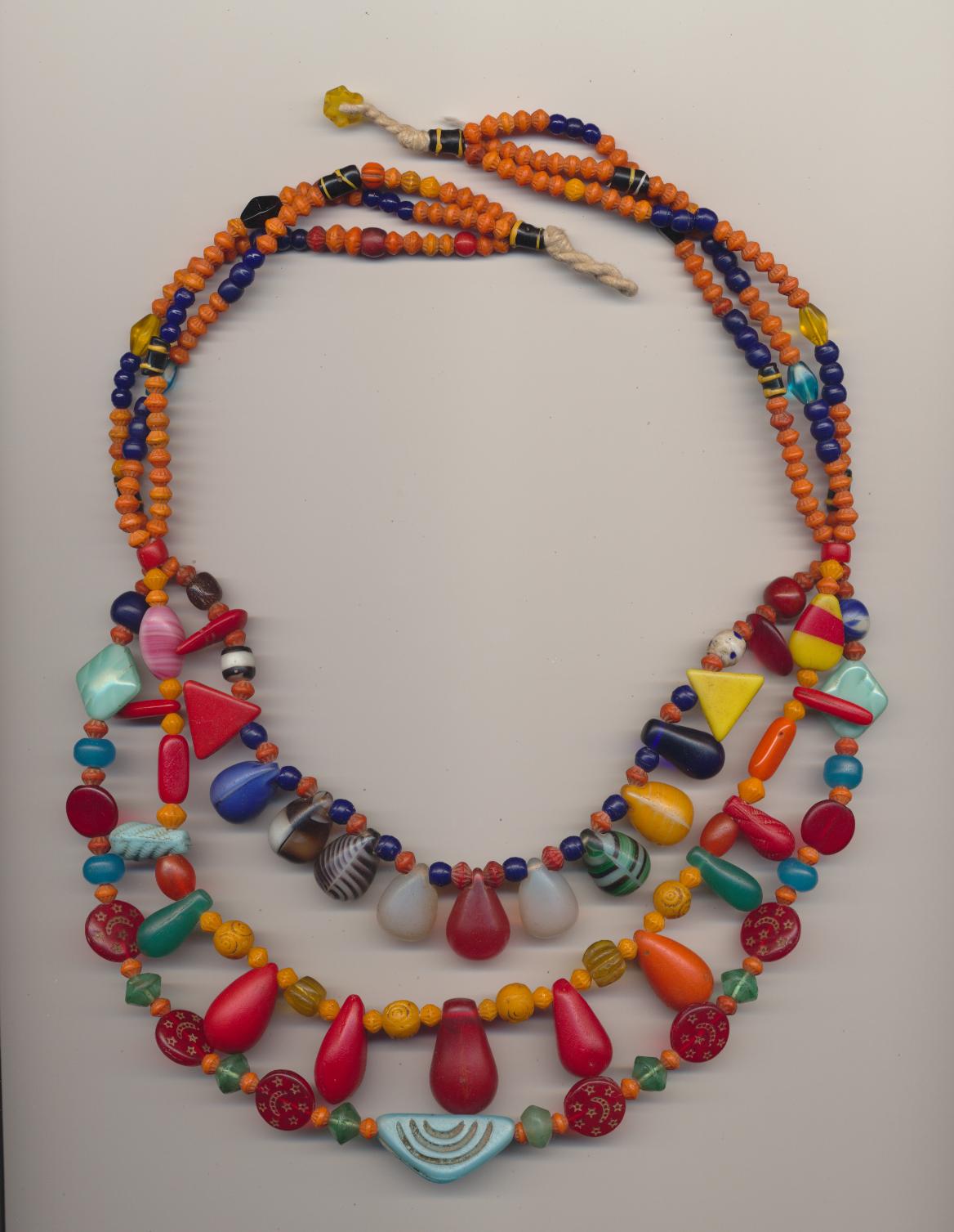 Old African Peul / Fulani wedding necklace made of Czech glass beads including imitation half Mpande conus disc, and Venetian glass trade beads, 1930's, length inner row 21'' 53cm., middle row 23'' 58cm., outer row 27'' 68cm.